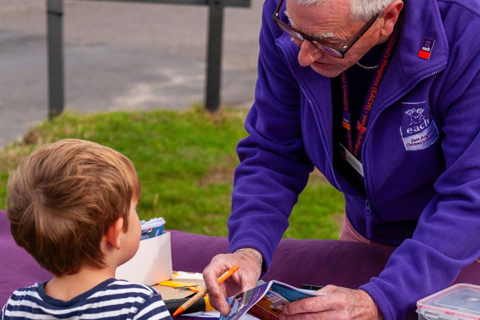 Volunteer and child